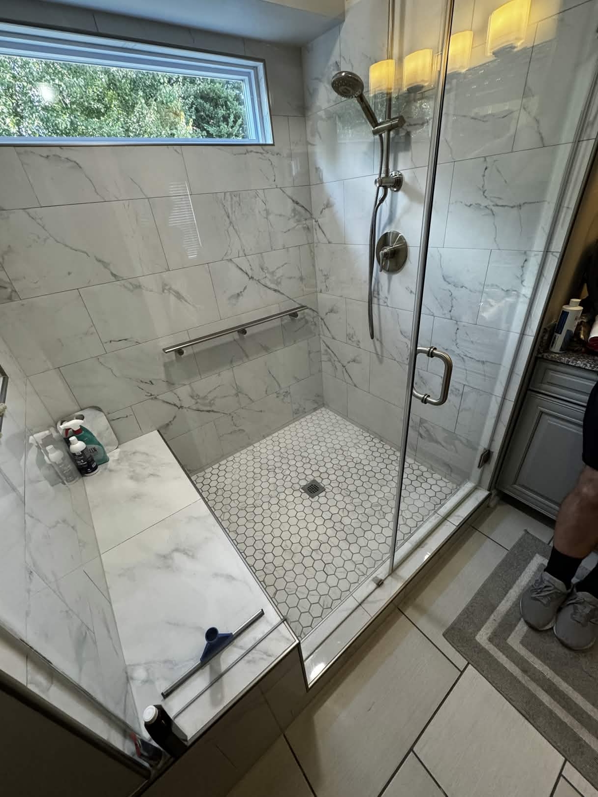 Marble walk-in shower with picture window